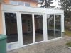 Nach der Renovierung. Es wurden neue Türen und Fenster eingebaut. Unsere Spengler haben die Holzverkleidung komplett im sichtbaren Bereich mit Aluweiß Blech verkleidet, so dass der Wintergarten in neuem Glanz erstrahlt.